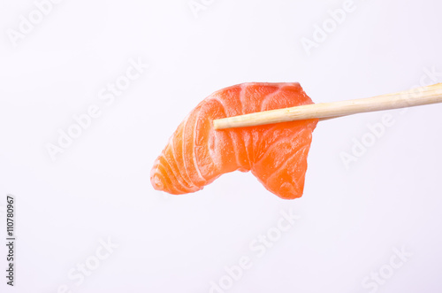 salmon with chopsticks isolated on white background
