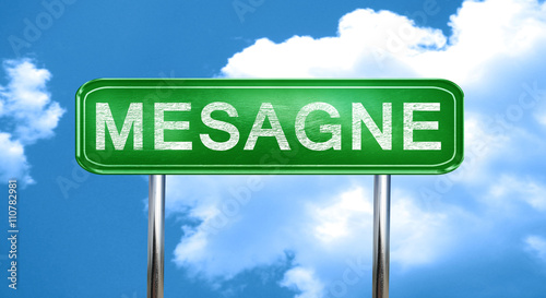 Фотография Mesagne vintage green road sign with highlights
