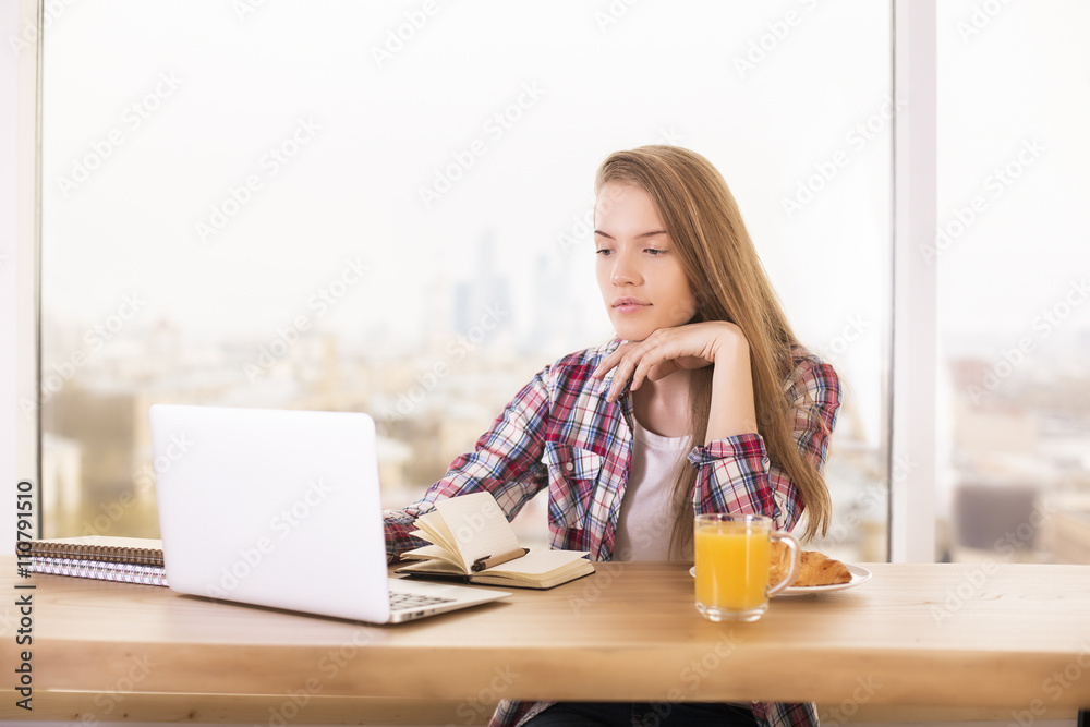 Girl using laptop in office Girl using laptop in office