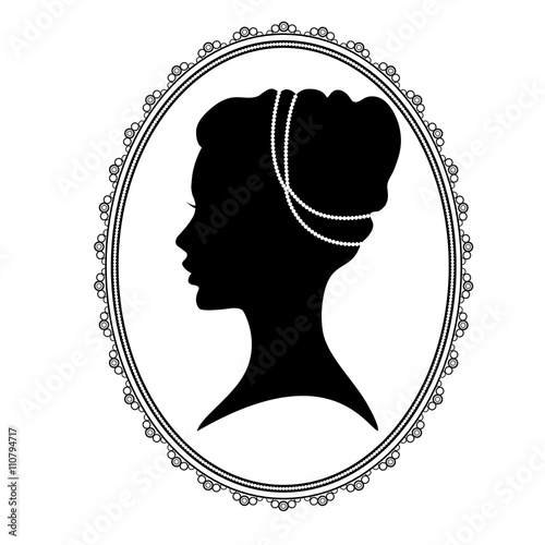 Black silhouette of a woman’s head in an oval decorative frame, locket. 