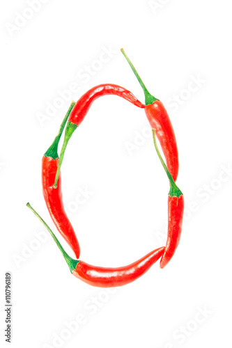 O Letter from red hot pepper on the white