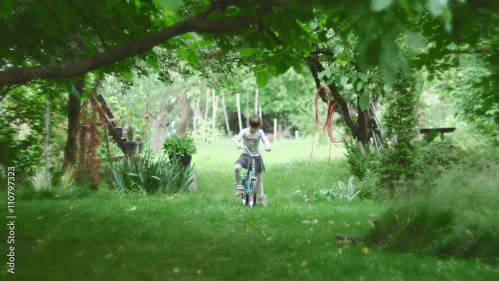 Cute girl riding a bike in nature
Cute girl riding a bike in nature