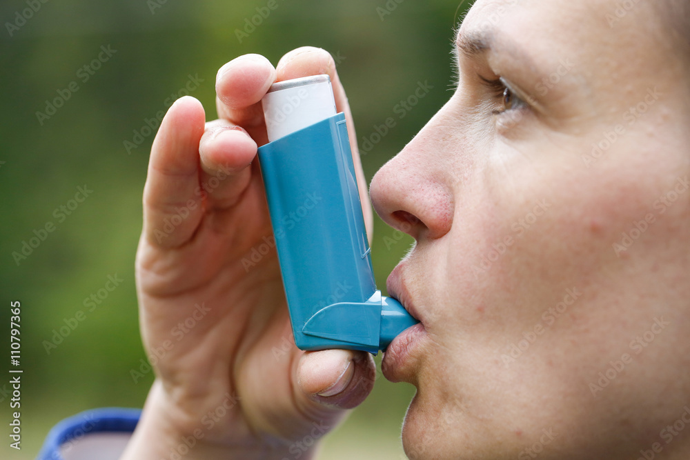 Asthma patient inhaling medication