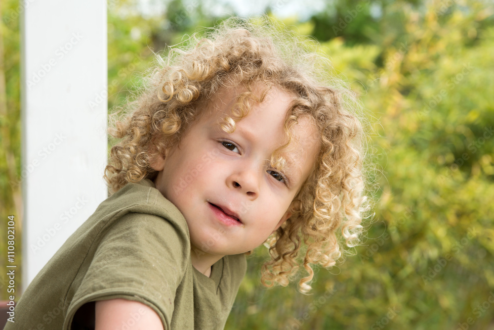 portrait of a young boy with blond curly hair portrait of a young boy with blond curly hair