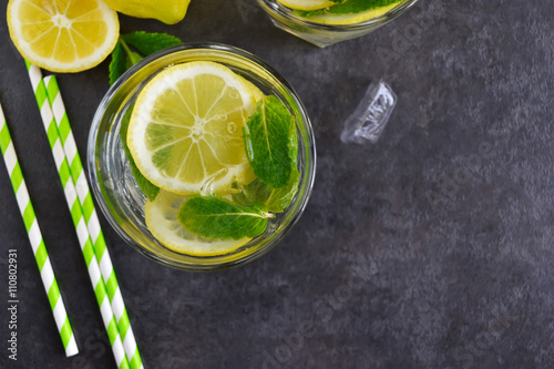 Summer Citrus lemonade with mint on black background