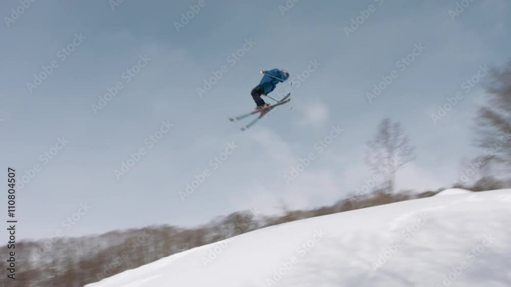 Skier Jumping Does a Double Backflip on a Jump