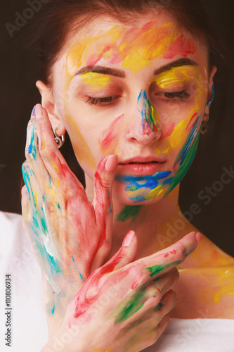Bright beautiful girl with art colorful make-up