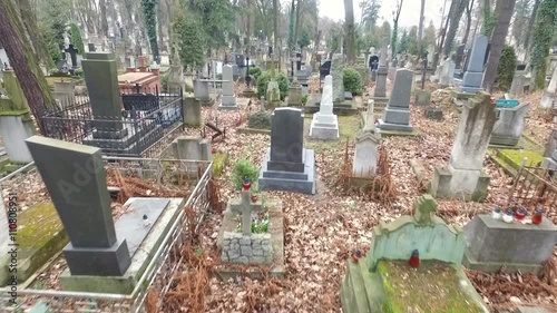 Shooting With the Aircraft Quadrocopter.camera Flies Over the Graves in the Cemetery of the Lviv. Camera Movement on the Crosses and Tombs.  photo