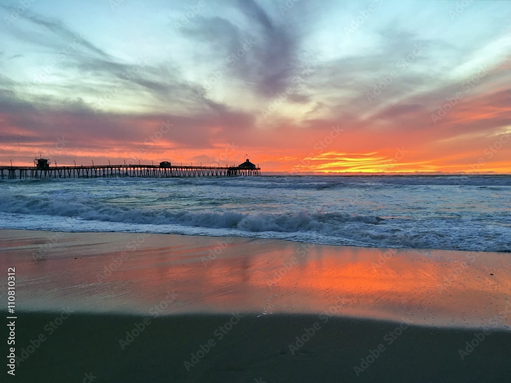 Pier at Imperial Beach in San Diego, California lit by a stunning sunset