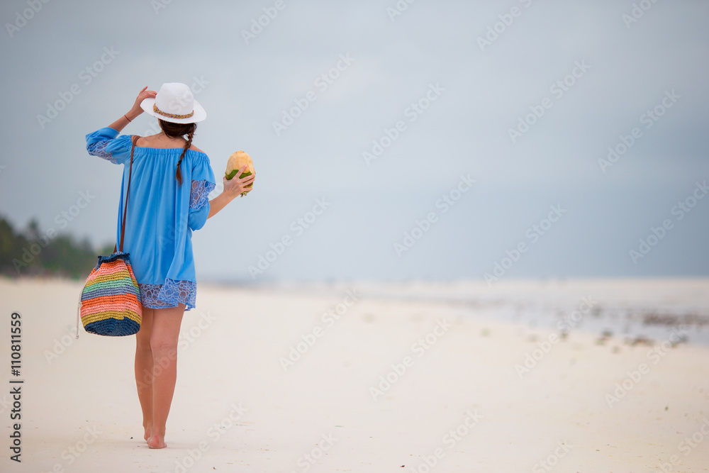 Young beautiful woman on beach vacation