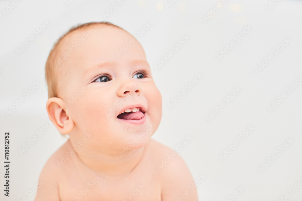 Portrait one year old baby bathtub in white Portrait one year old baby bathtub in white