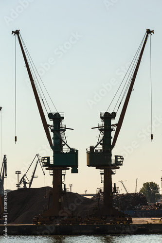 Cranes in morning harbour.