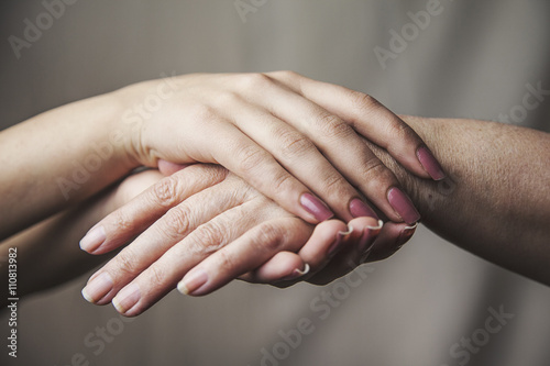 young and old womans hands