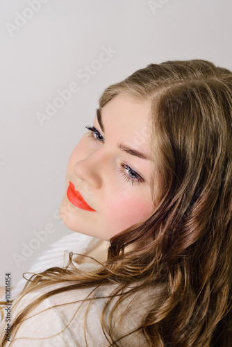 emotionless young woman posing on a white background