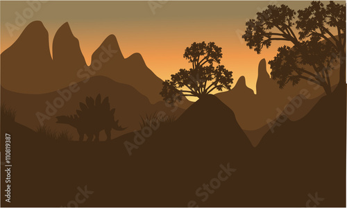 silhouette of stegosaurus in hills