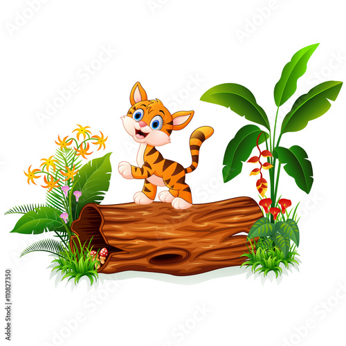 Fototapeta Naklejka Na Ścianę i Meble -  Cartoon baby tiger on tree trunk
