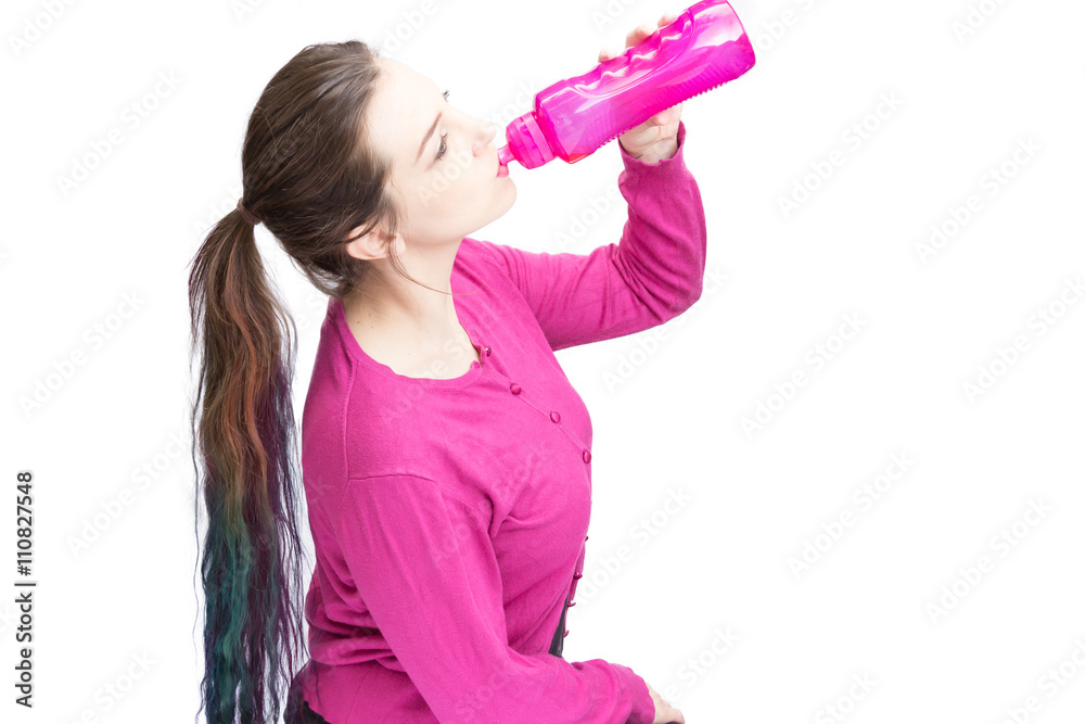 Pretty woman with long hair drinking from bottle Pretty woman with long hair drinking from bottle