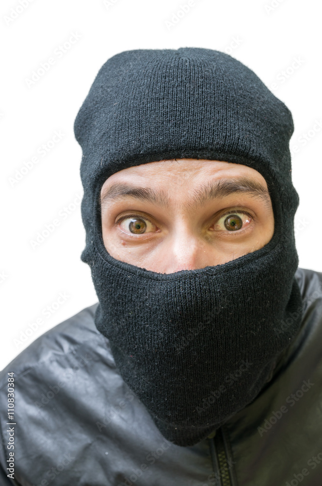 Face of burglar masked with balaclava. Isolated on white background. Face of burglar masked with balaclava. Isolated on white background.