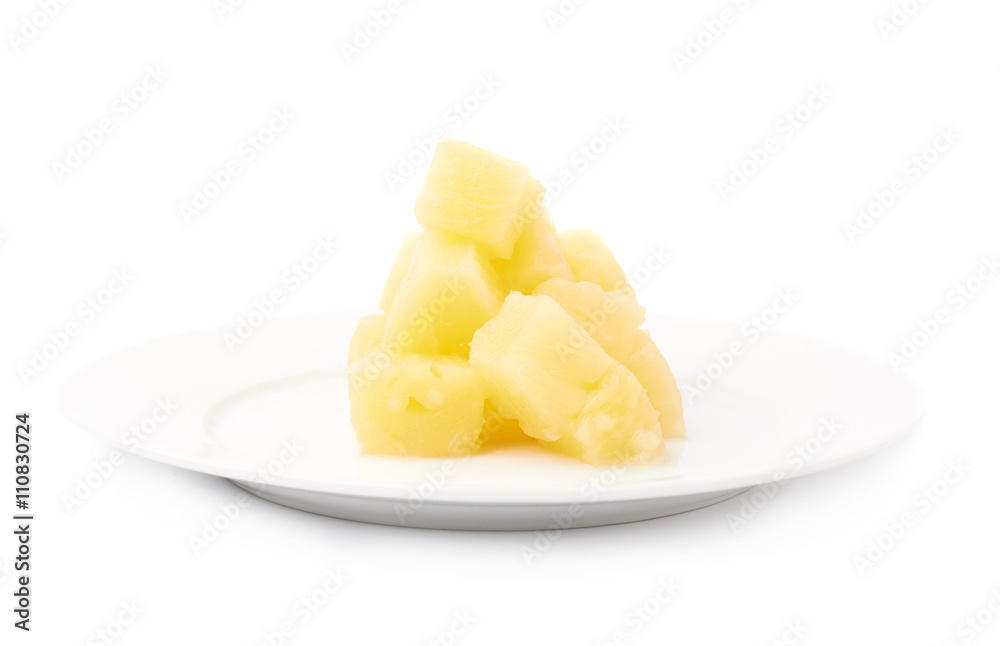 Pile of canned pineapple over isolated white background Pile of canned pineapple over isolated white background