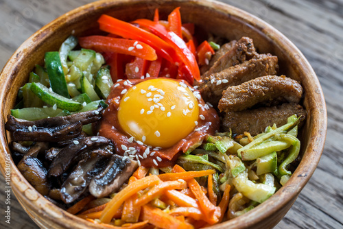 Bowl of bibimbap on the wooden table