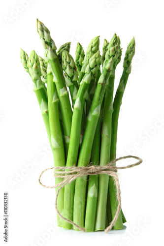 fresh asparagus wrapped with rope on white isolated background