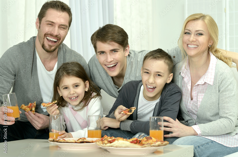 family at home with pizza