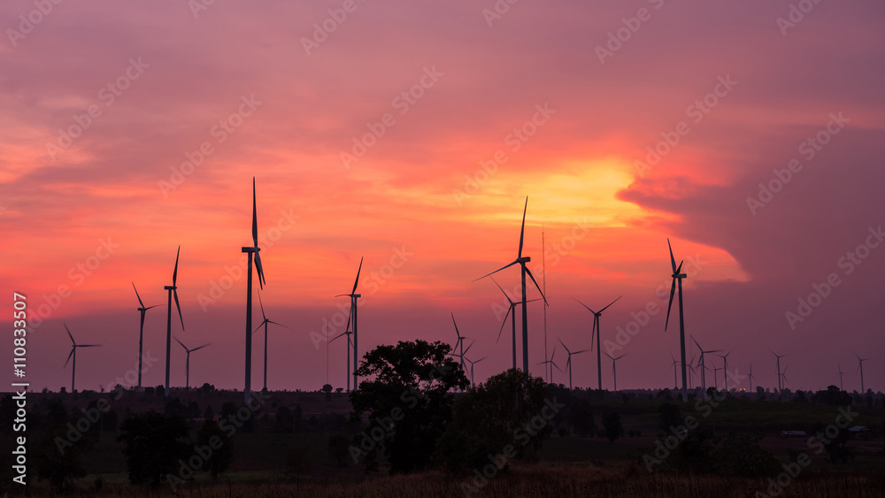 Obraz premium Wind turbine power generator at twilight