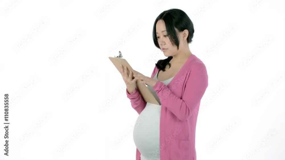 Pregnant adult asian woman isolated on a white background