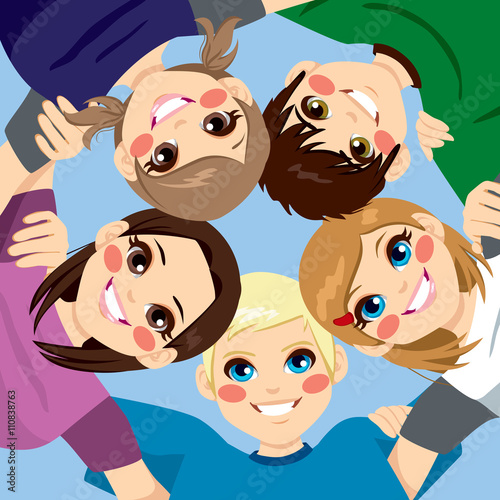 Five happy young smiling teenagers embracing together in circle from low angle view