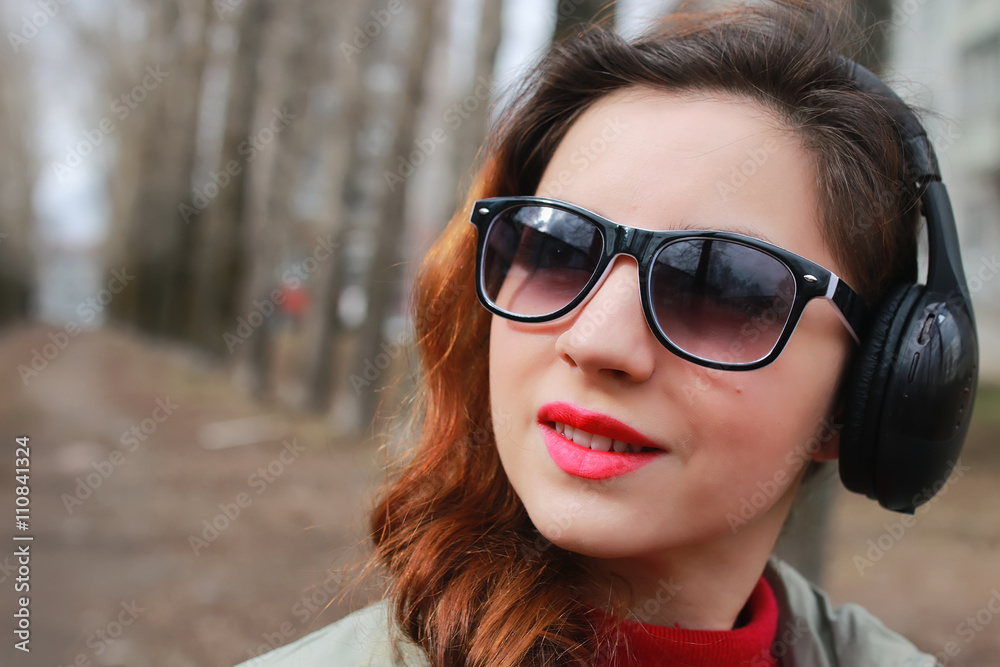 woman with headphones in park autumn woman with headphones in park autumn