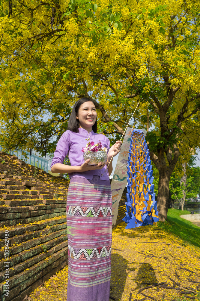Young Thai girl at temple in songkran festival ,Chiangmai Thailand. Young Thai girl at temple in songkran festival ,Chiangmai Thailand.