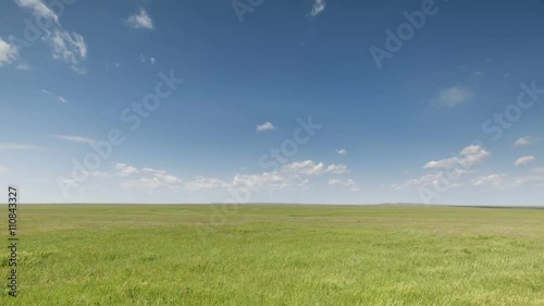 Russia, timelapse. The movement of clouds over the fields of winter wheat in early spring in the vast steppes of the Don.