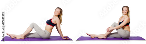 Young female doing exercises on white