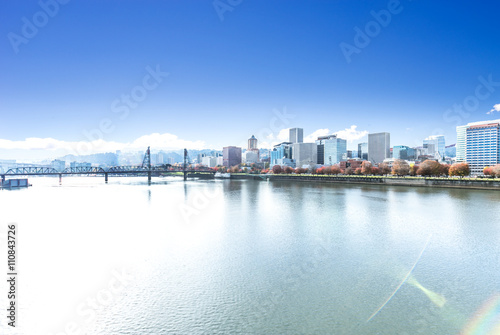 bridge over water with cityscape and skyline of portland