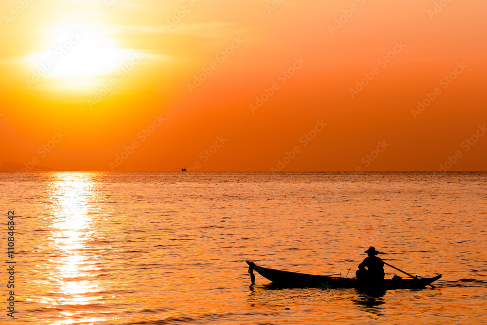 Silhouette of fishermen and his. sailing in the sea. Asian man o Silhouette of fishermen and his. sailing in the sea. Asian man o