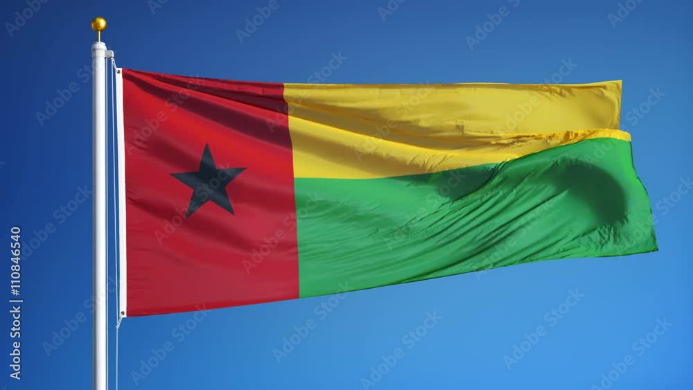 Guinea Bissau flag waving in slow motion against clean blue sky, seamlessly looped, close up, isolated on alpha channel with black and white matte, perfect for film, news, digital composition Guinea Bissau flag waving in slow motion against clean blue sky, seamlessly looped, close up, isolated on alpha channel with black and white matte, perfect for film, news, digital composition
