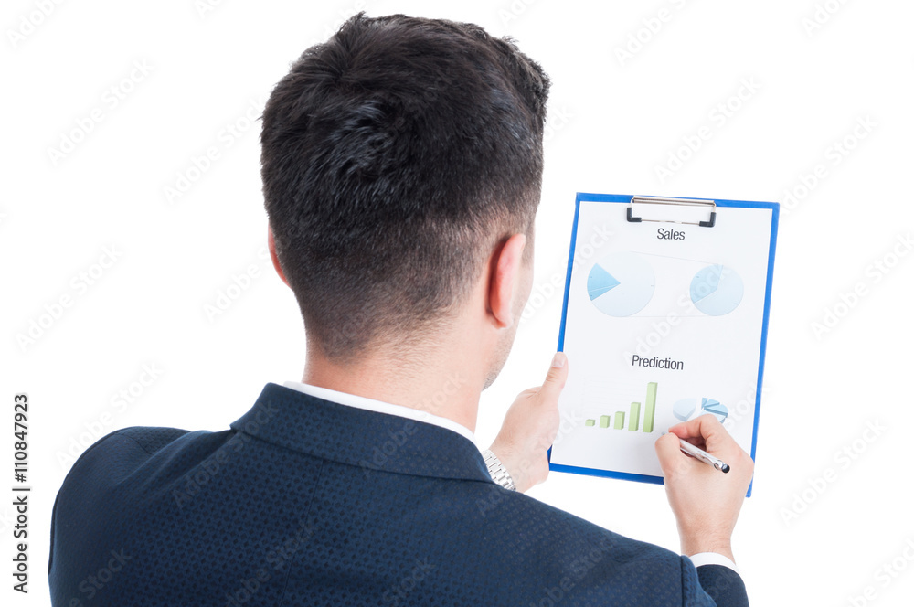 Back view of successful salesman holding clipboard with charts Back view of successful salesman holding clipboard with charts
