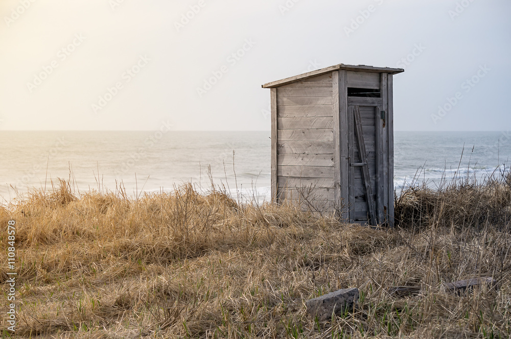 wooden toilet on the beach