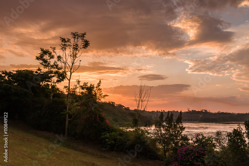 Victoria Nile riverside at dawn against hydropower background. Jinja, Uganda, Eastern Africa.