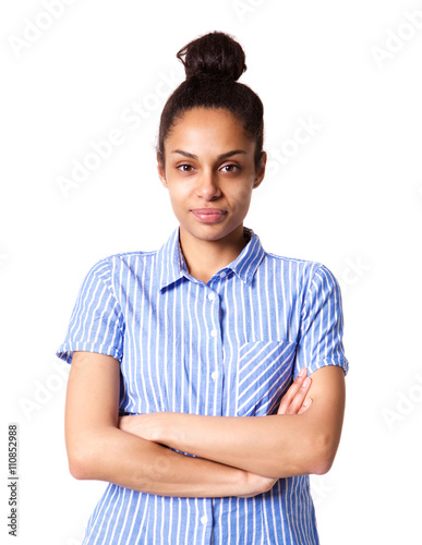 Attractive young african woman standing with her arms crossed