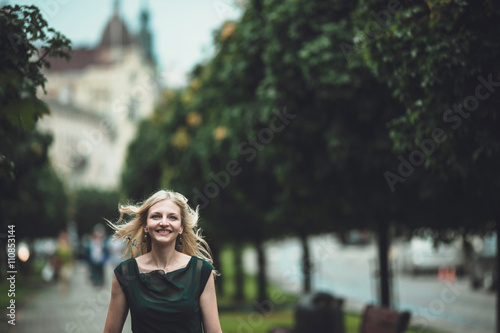 smiling blonde spends his time in the beautiful big city. © andriychuk