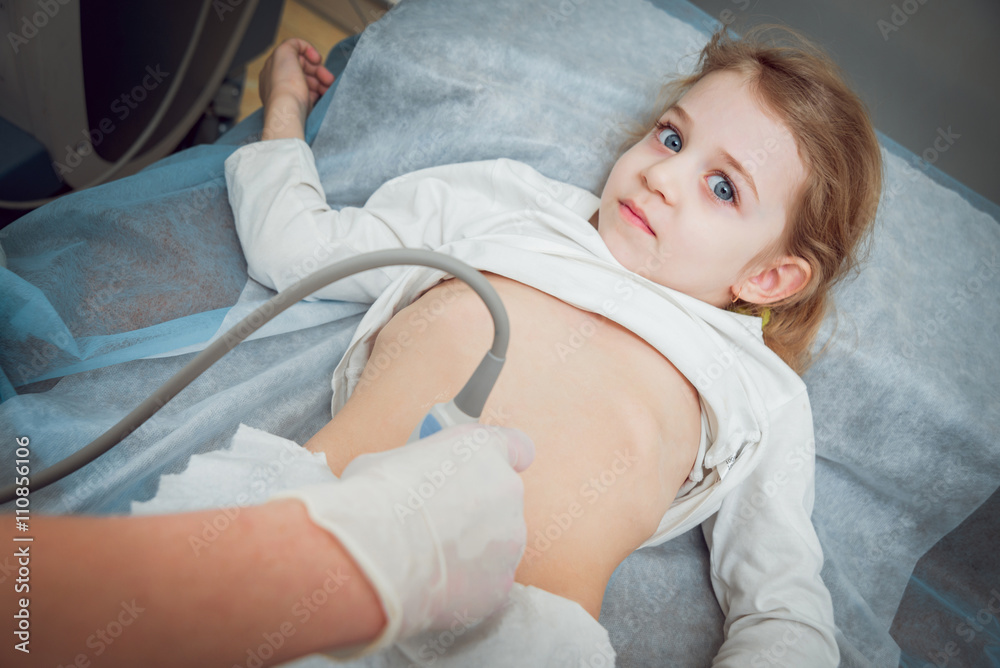Doctor and little girl patient. Ultrasound equipment. Doctor and little girl patient. Ultrasound equipment.
