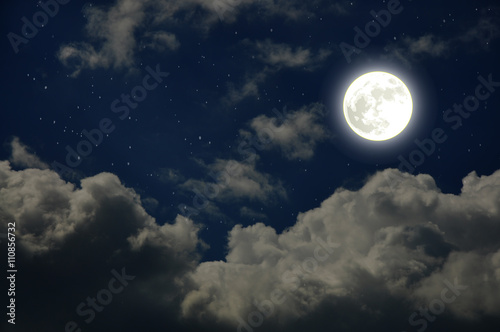 Beautiful starry night sky with clouds and moon