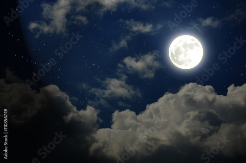 Beautiful starry night sky with clouds and moon