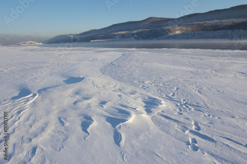                     .                                                                                 . Ice on the river. The winter sunny day lightens mood