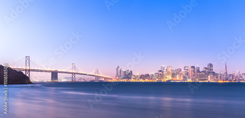water bay bridge with cityscape and skyline of san francisco