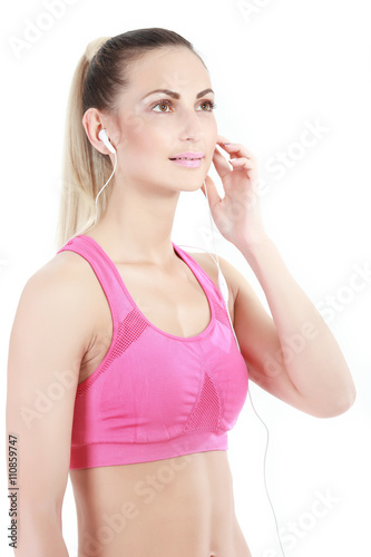 fitness woman in sport style standing against white background.