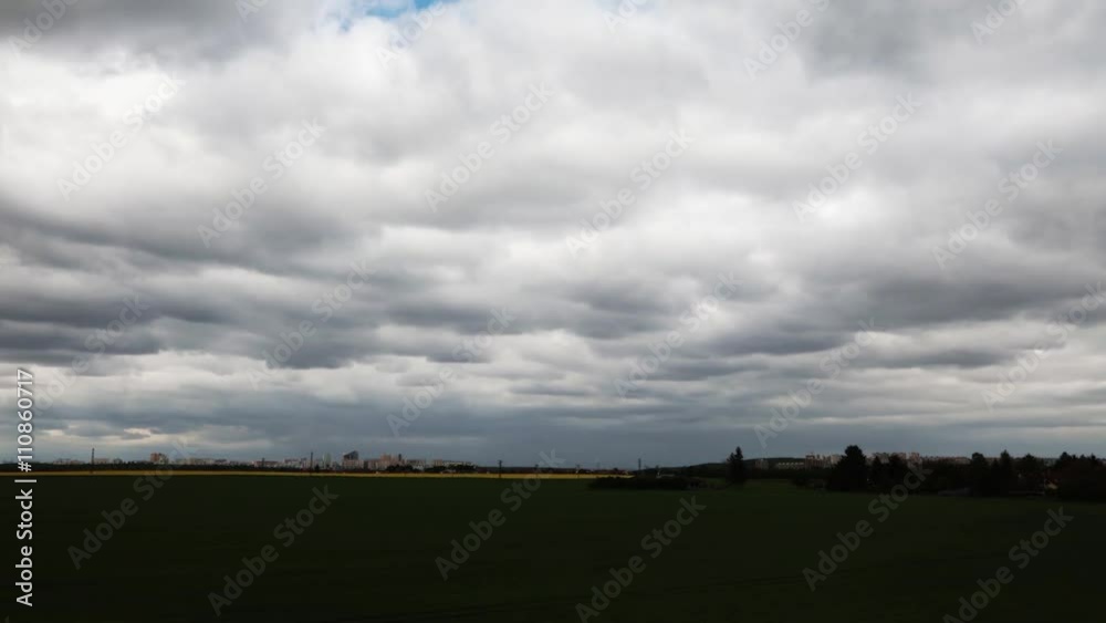 Time-lapse of cloudy sky with modern cityscape of Prague Time-lapse of cloudy sky with modern cityscape of Prague