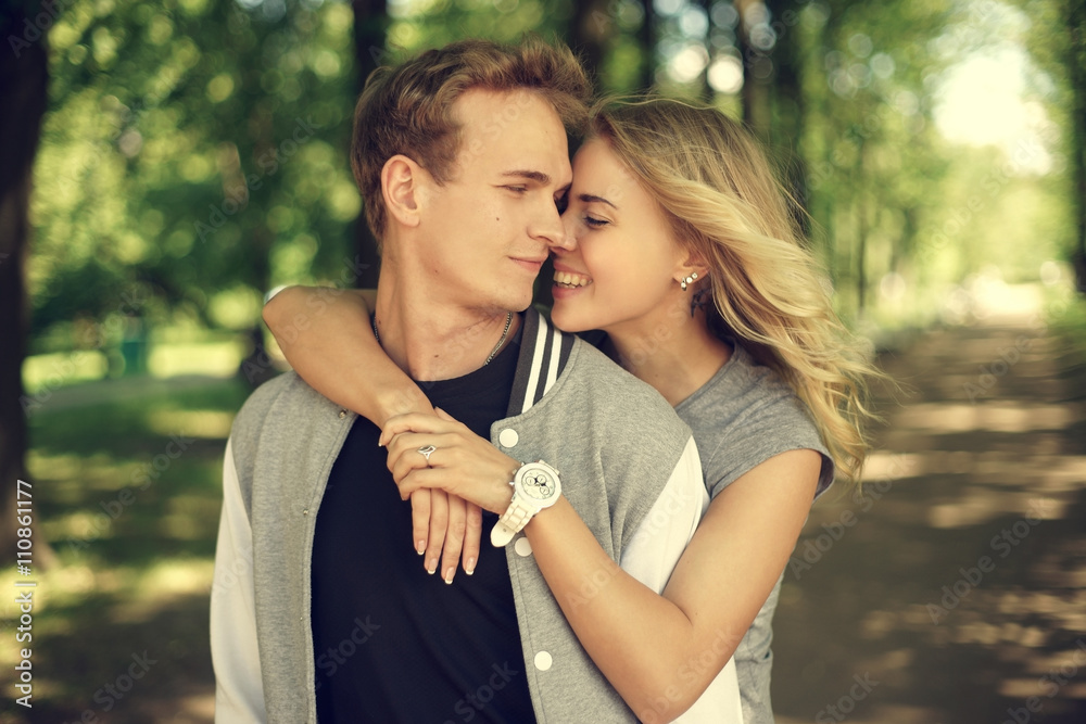 Fototapeta premium lovely couple hugging in summer park
