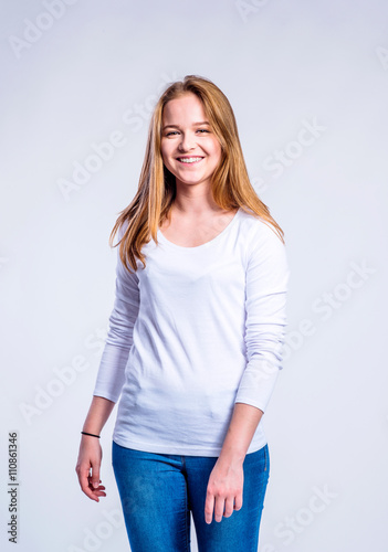 Girl in jeans and t-shirt, young woman, studio shot